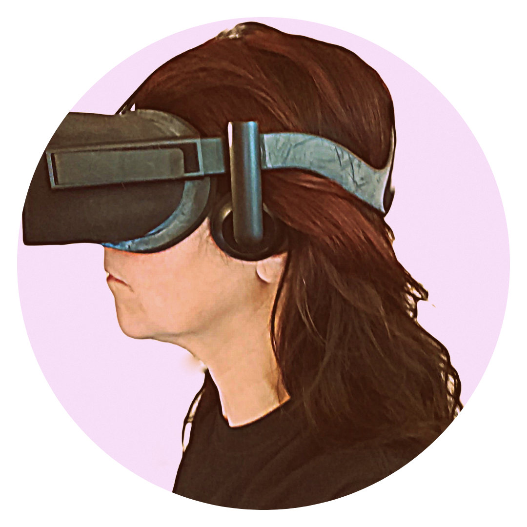 A photograph of the artist, Jacki Clarke, taken in profile while wearing a VR headset.